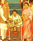 CM Felicitates Baragur Ramachandrappa with Rajyothsava award