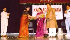Left to Right: Mr. Chidananda, Meena Vishwanath (emcee), Mrs. Geetha Nataraj, Dr. M.S. Nataraj and Mr. Subby Subramanyam. (Photo by: Rama Rau)